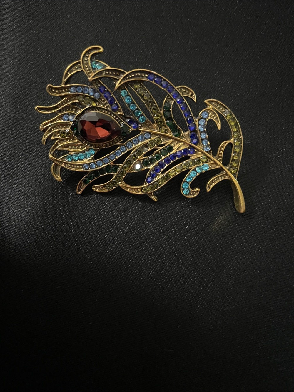 Source Unknown Gold Peacock Feather Brooch with Blue, Teal, and Garnet Rhineston